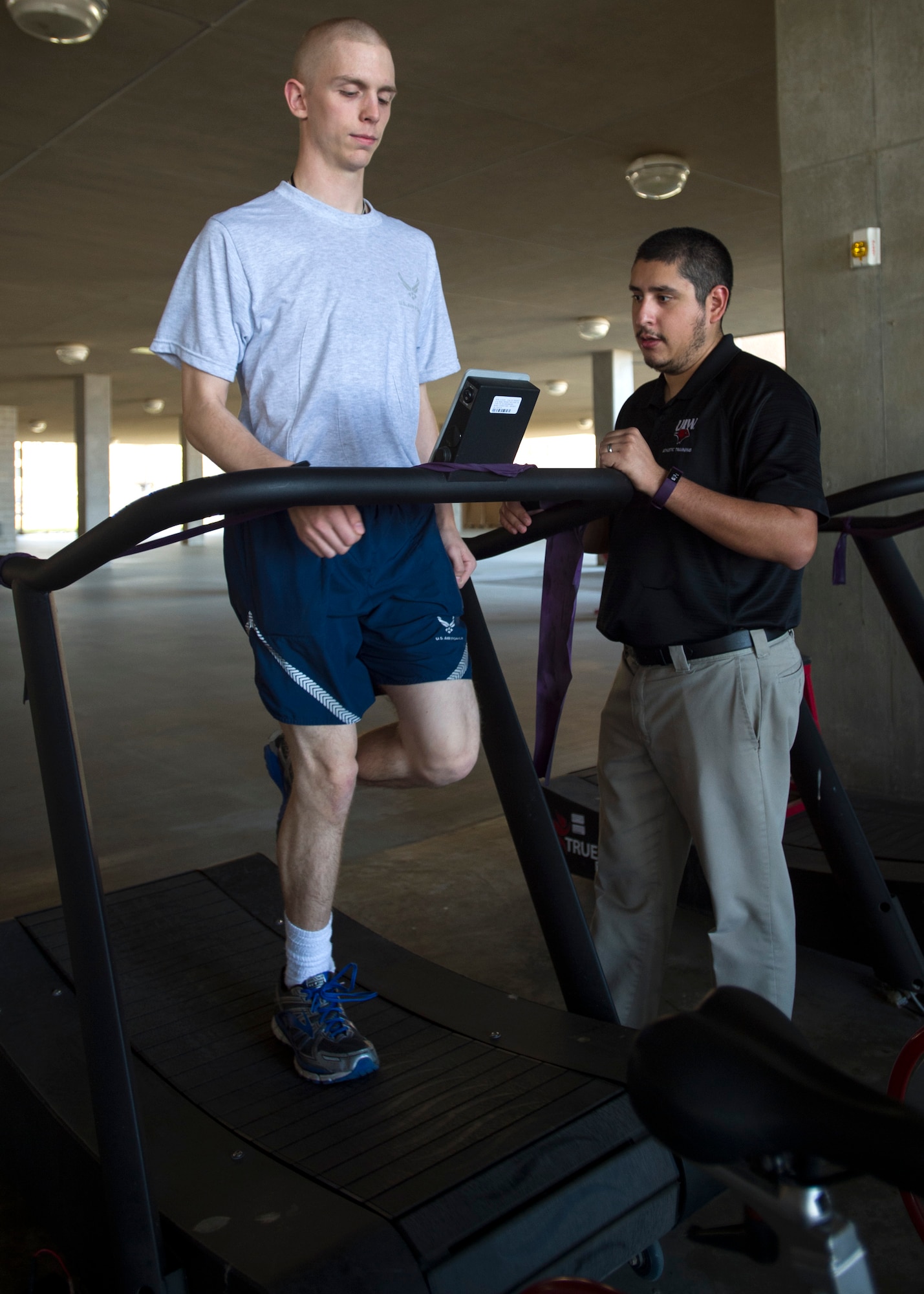 Arnoldo Gonzalez, an athletic trainer embedded with the 559th Medical Group’s VIPER Clinic, assesses trainee Alec Sollars on a trueform treadmill at the 559th MDG VIPER Clinic on Joint Base San Antonio-Lackland, Texas, Nov. 29. This treadmill is completely motorless and is uniquely designed so that it does not allow anyone to run on it with improper running form. This instant feedback tool that teaches trainees how to properly run and hopefully prevent any further injuries.