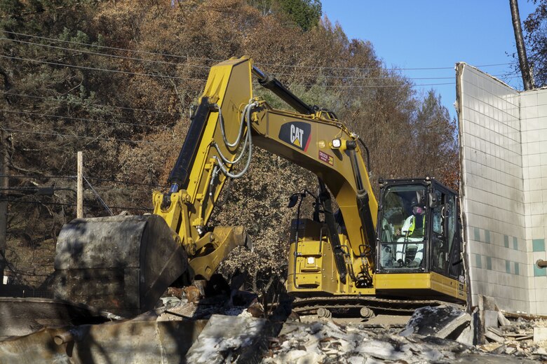 Crews work to remove debris from Santa Rosa Fire Department's old Station 5 location on Parker Hill Road.