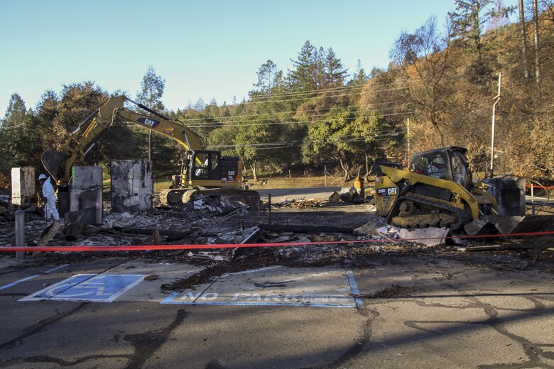 Crews work to remove debris from Santa Rosa Fire Department's old Station 5 location on Parker Hill Road.