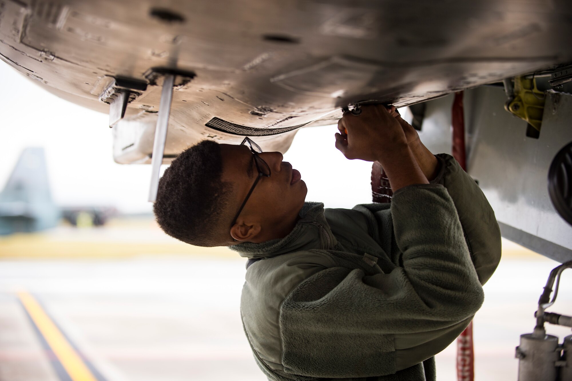 A crew chief from the 23d Aircraft Maintenance Squadron secures a panel on an A-10C Thunderbolt II during a thru flight inspection, Dec. 7, 2017, at Moody Air Force Base, Ga. Moody recently participated in a week-long, Phase 1, Phase 2 exercise designed to demonstrate the 23d Wing’s ability to meet combatant commander objectives. The exercise tested pilots’ and maintainers’ ability to launch around-the-clock sorties at an accelerated rate during surge operations. (U.S. Air Force photo by Andrea Jenkins)