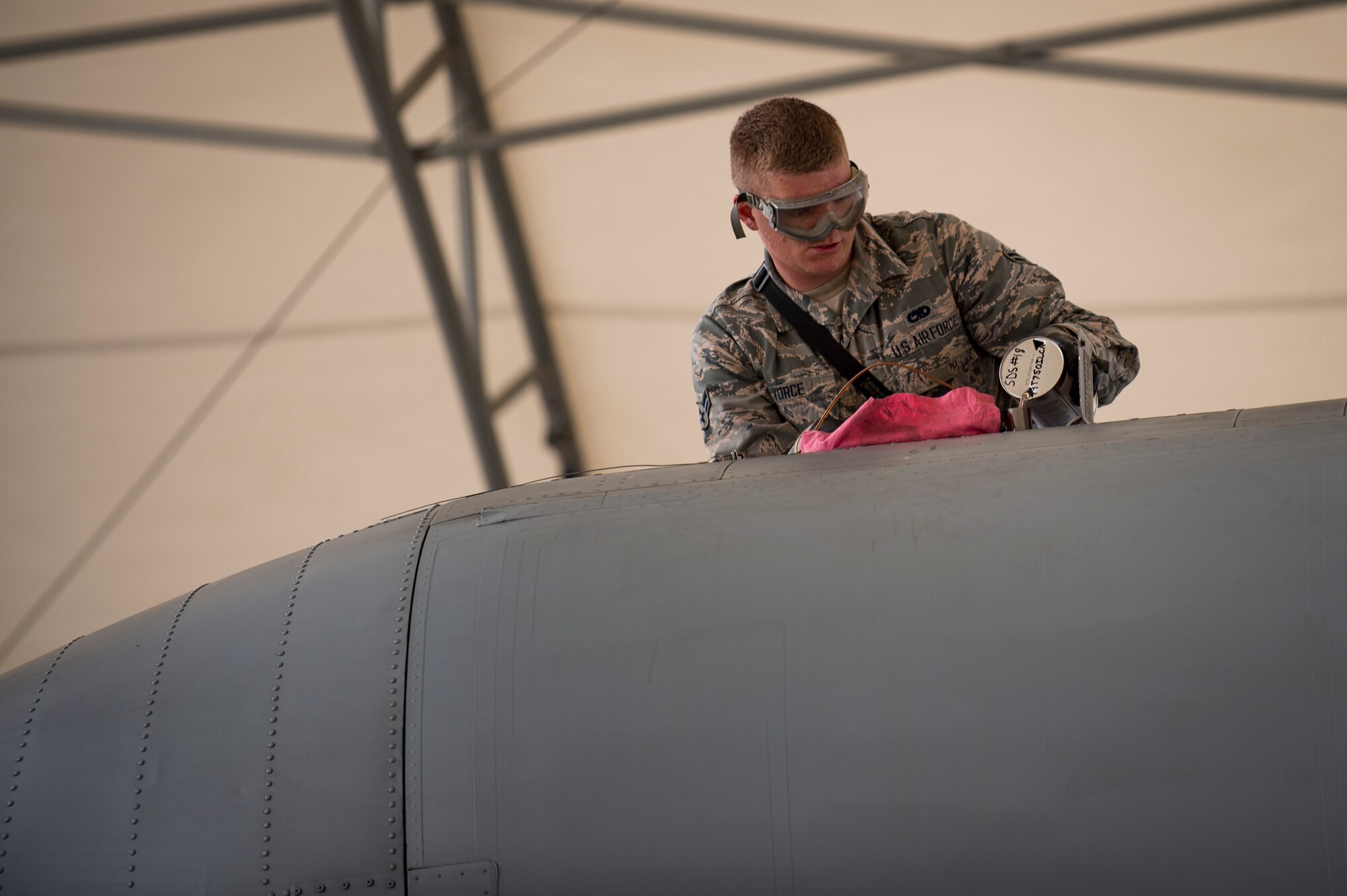 Airman 1st Class Gabriel Vorce, 23d Aircraft Maintenance Squadron crew chief, refills the oil on an A-10C Thunderbolt II during a thru flight inspection, Dec. 7, 2017, at Moody Air Force Base, Ga. Moody recently participated in a week-long, Phase 1, Phase 2 exercise designed to demonstrate the 23d Wing’s ability to meet combatant commander objectives. The exercise tested pilots’ and maintainers’ ability to launch around-the-clock sorties at an accelerated rate during surge operations. (U.S. Air Force photo by Andrea Jenkins)