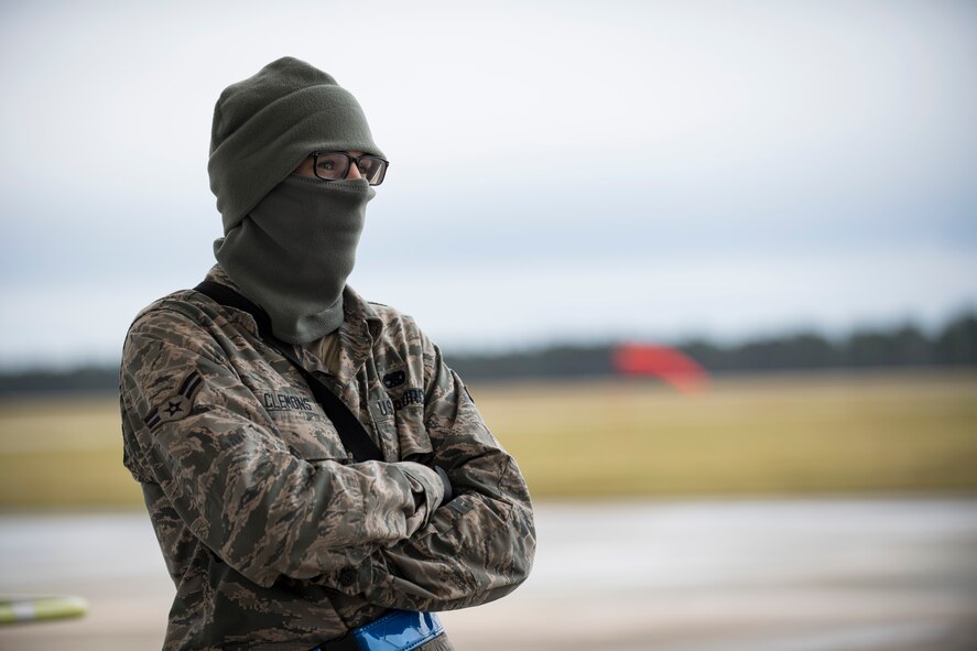 A crew chief watches as fellow maintainers preform a thru flight inspection on an A-10C Thunderbolt II, Dec. 7, 2017, at Moody Air Force Base, Ga. Moody recently participated in a week-long, Phase 1, Phase 2 exercise designed to demonstrate the 23d Wing’s ability to meet combatant commander objectives. The exercise tested pilots’ and maintainers’ ability to launch around-the-clock sorties at an accelerated rate during surge operations. (U.S. Air Force photo by Andrea Jenkins)