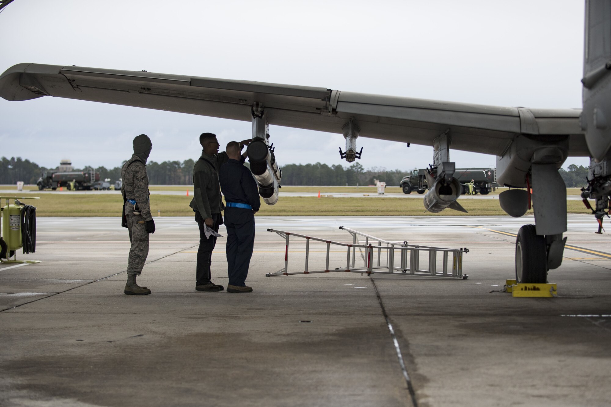 Airmen from the 23d Maintenance Group perform a thru flight inspection on an A-10C Thunderbolt II, Dec. 7, 2017, at Moody Air Force Base, Ga. Moody recently participated in a week-long, Phase 1, Phase 2 exercise designed to demonstrate the 23d Wing’s ability to meet combatant commander objectives. The exercise tested pilots’ and maintainers’ ability to launch around-the-clock sorties at an accelerated rate during surge operations. (U.S. Air Force photo by Andrea Jenkins)