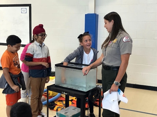 Lake Sidney Lanier Park Ranger Rachel Rush teaches fourth graders the importance of water safety and the beauty of our national parks during a visit to a local school earlier this year. Rush was recently recognized for her efforts to promote the Every Kid in a Park initiative by the U.S. Army Corps of Engineers, South Atlantic Division.