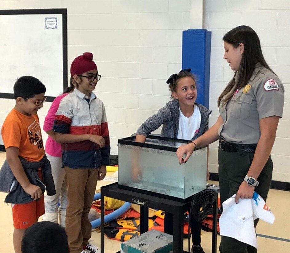 Lake Sidney Lanier Park Ranger Rachel Rush teaches fourth graders the importance of water safety and the beauty of our national parks during a visit to a local school earlier this year. Rush was recently recognized for her efforts to promote the Every Kid in a Park initiative by the U.S. Army Corps of Engineers, South Atlantic Division.