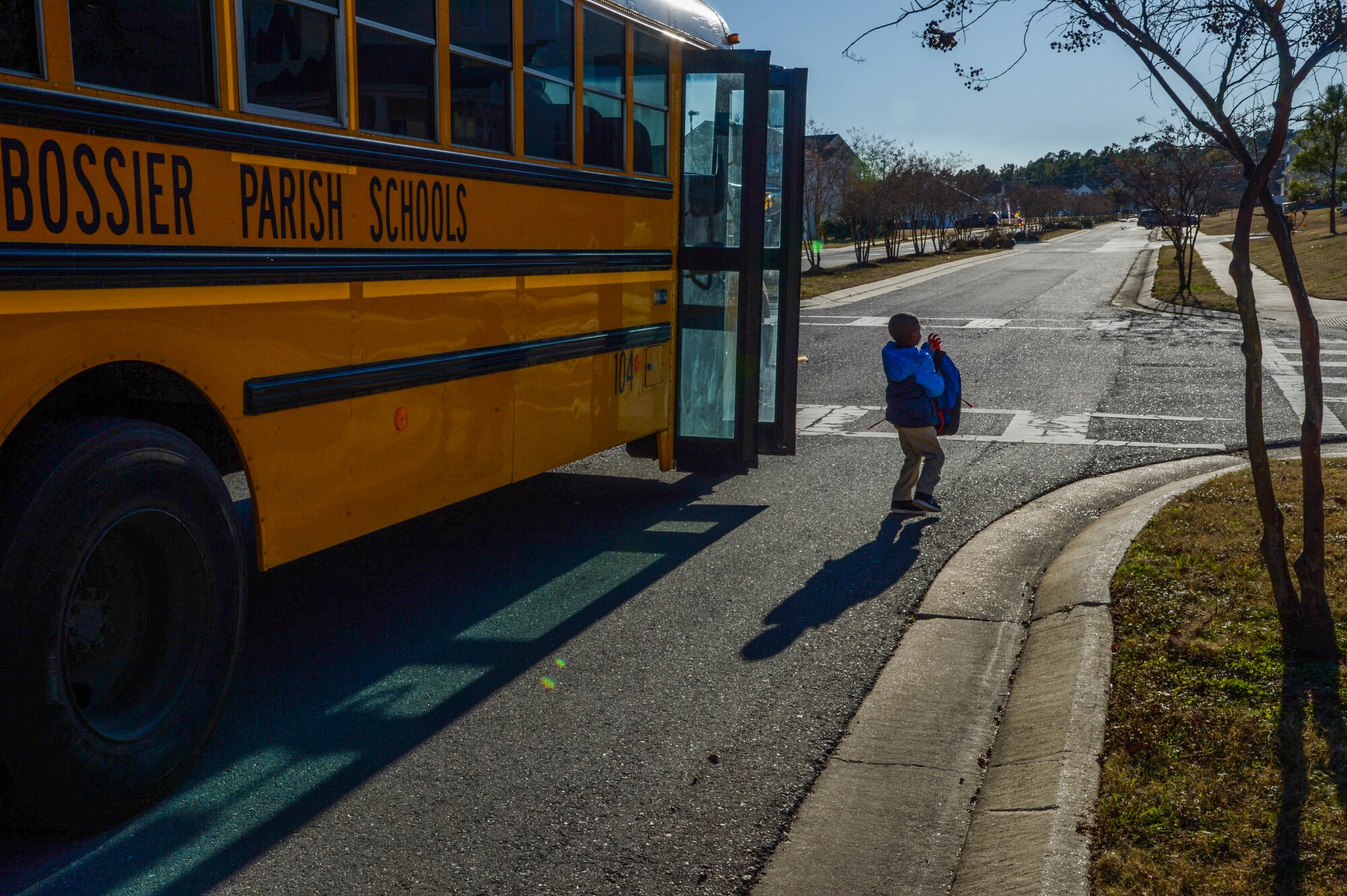 A child steps off a bus after school at Barksdale Air Force Base La., dec. 7, 2017. The Bossier Parish School Board approved the rezoning of barksdale to allow transportation to Haughton schools.