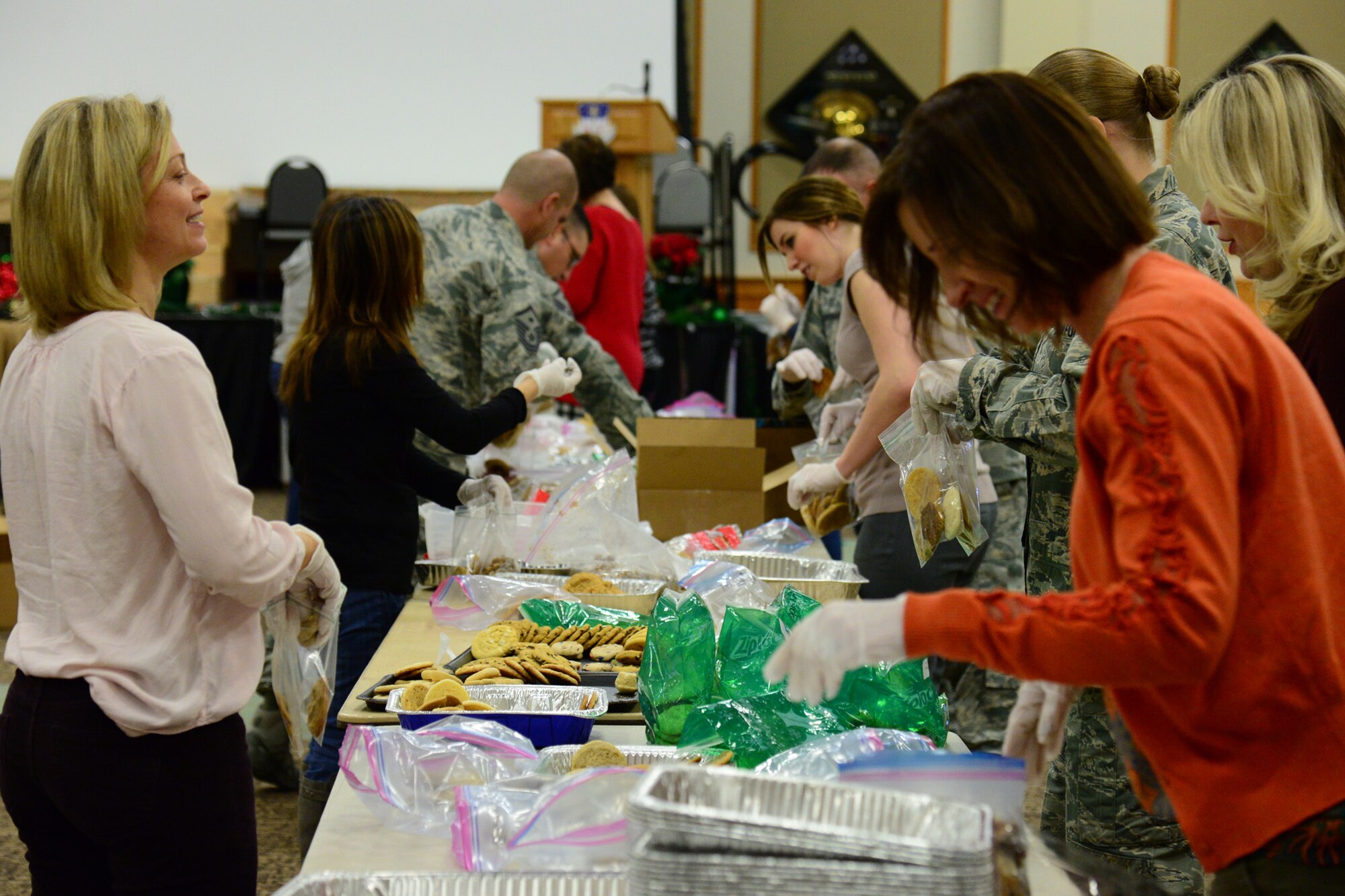 Cookie Express volunteers from local and base communities gather to package cookies for dorm Airmen Dec. 13, 2017, at Malmstrom Air Force Base, Mont.