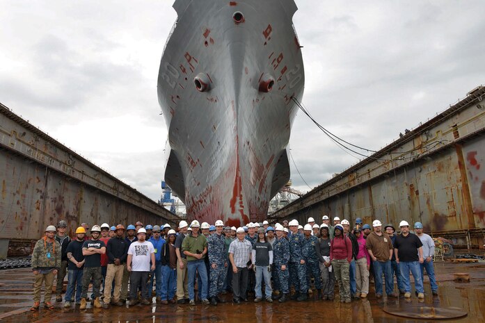 SSC Atlantic Commanding Officer Capt. Scott Heller poses with the government and industry partner team after the drydocking of command and control ship USS Mount Whitney (LCC 20) in Croatia in December.