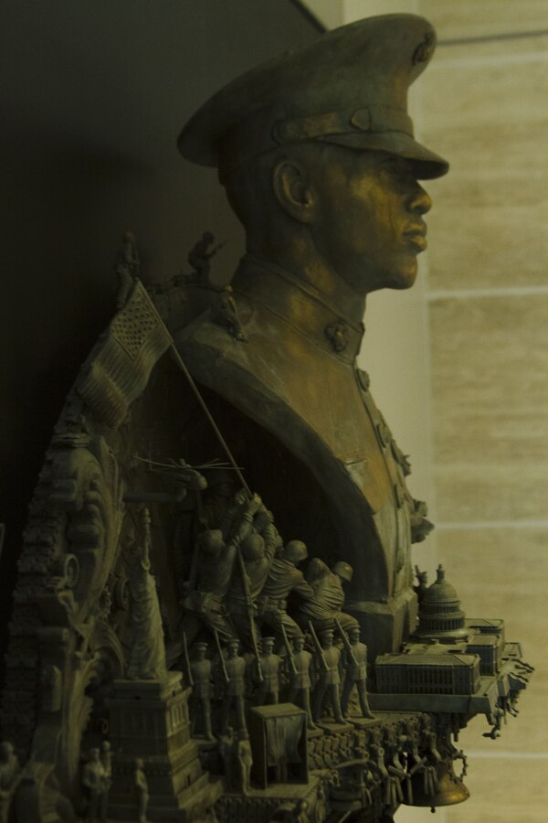 Nation’s Call, one of three of Marine Corps Recruiting Command’s statues, is unveiled at the National Marine Corps Museum in Triangle, Virginia, Dec. 13, 2017. The sculptures were crafted by Kris Kuksi for MCRC’s Battles Won brand idea and its advertisements, but also to represent the irreducible fighting spirit of Marines. Kuksi is an artist contracted to work with MCRC's contracted advertisement agency, J. Walter Thompson. (U.S. Marine Corps photo by Pfc. Mitchell Collyer)