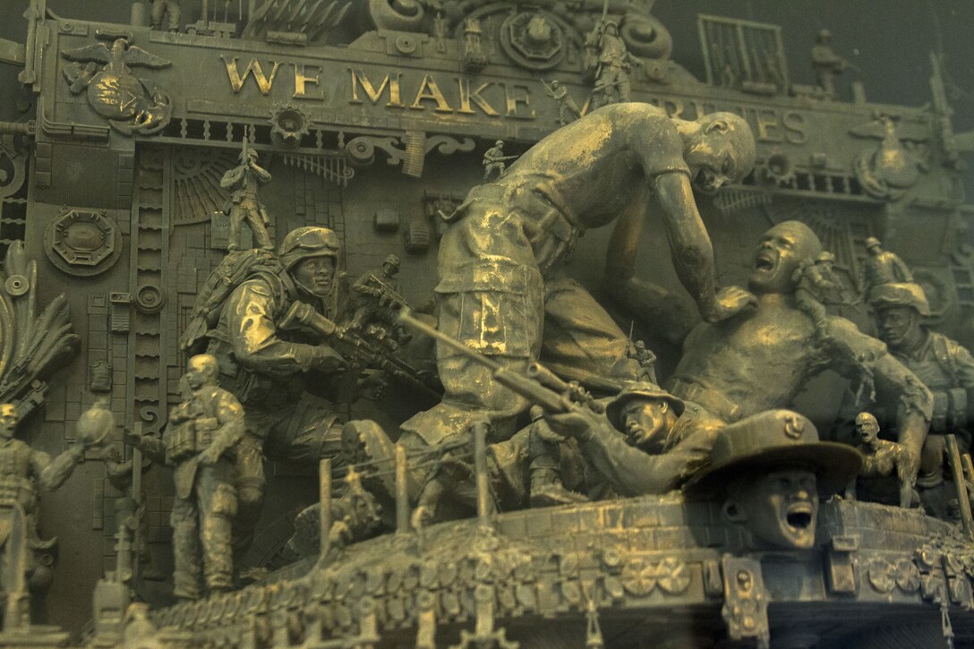 Waged in Will, one of three of Marine Corps Recruiting Command’s statues, is unveiled at the National Marine Corps Museum in Triangle, Virginia, Dec. 13, 2017. The sculptures were crafted by Kris Kuksi for MCRC’s Battles Won brand idea and its advertisements, but also to represent the irreducible fighting spirit of Marines. Kuksi is an artist contracted to work with MCRC's contracted advertisement agency, J. Walter Thompson. (U.S. Marine Corps photo by Pfc. Mitchell Collyer)