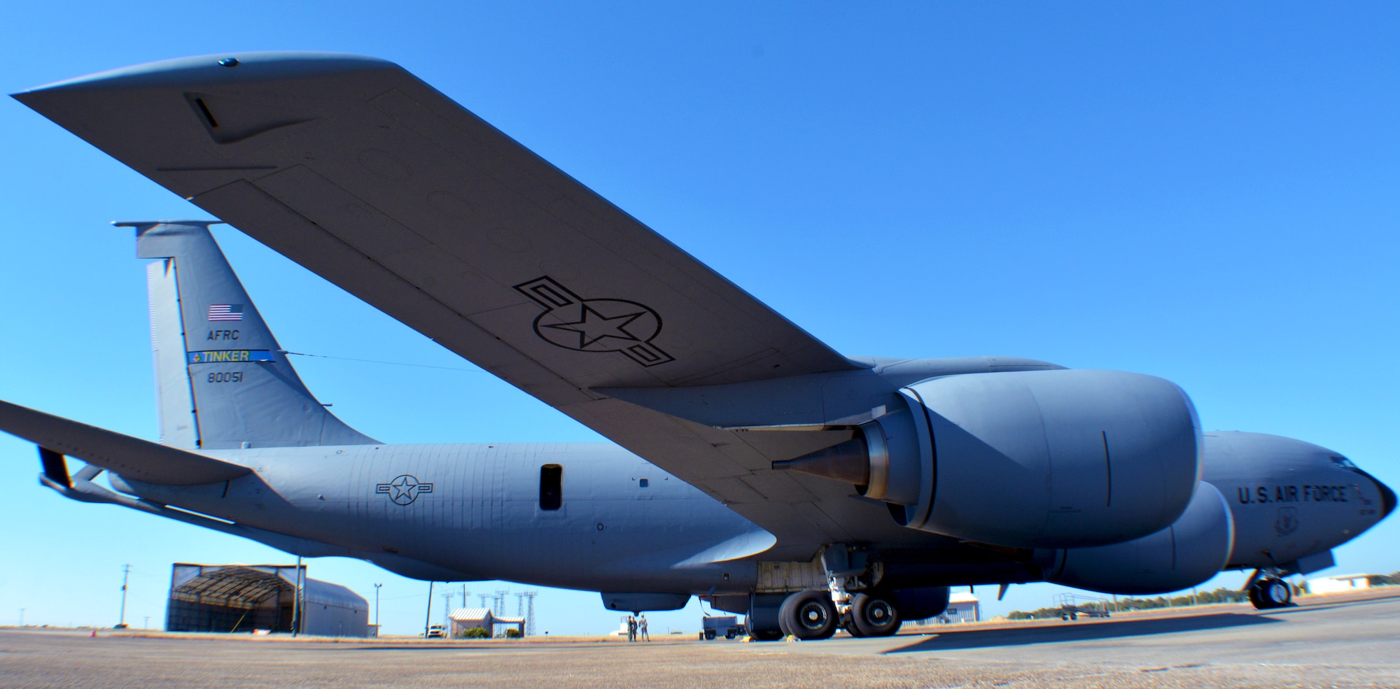 A 507th Air Refueling Wing KC-135R Stratotanker from Tinker Air Force Base, Okla., sits on the flight line at Eglin Air Force Base, Fla., while a maintenance crew prepares it for flight Nov. 28, 2017. This particular aircraft has been reconfigured to use the Large Aircraft Infrared Countermeasures system, which is designed to deflect incoming missiles. (U.S. Air Force photo/Tech. Sgt. Samantha Mathison)