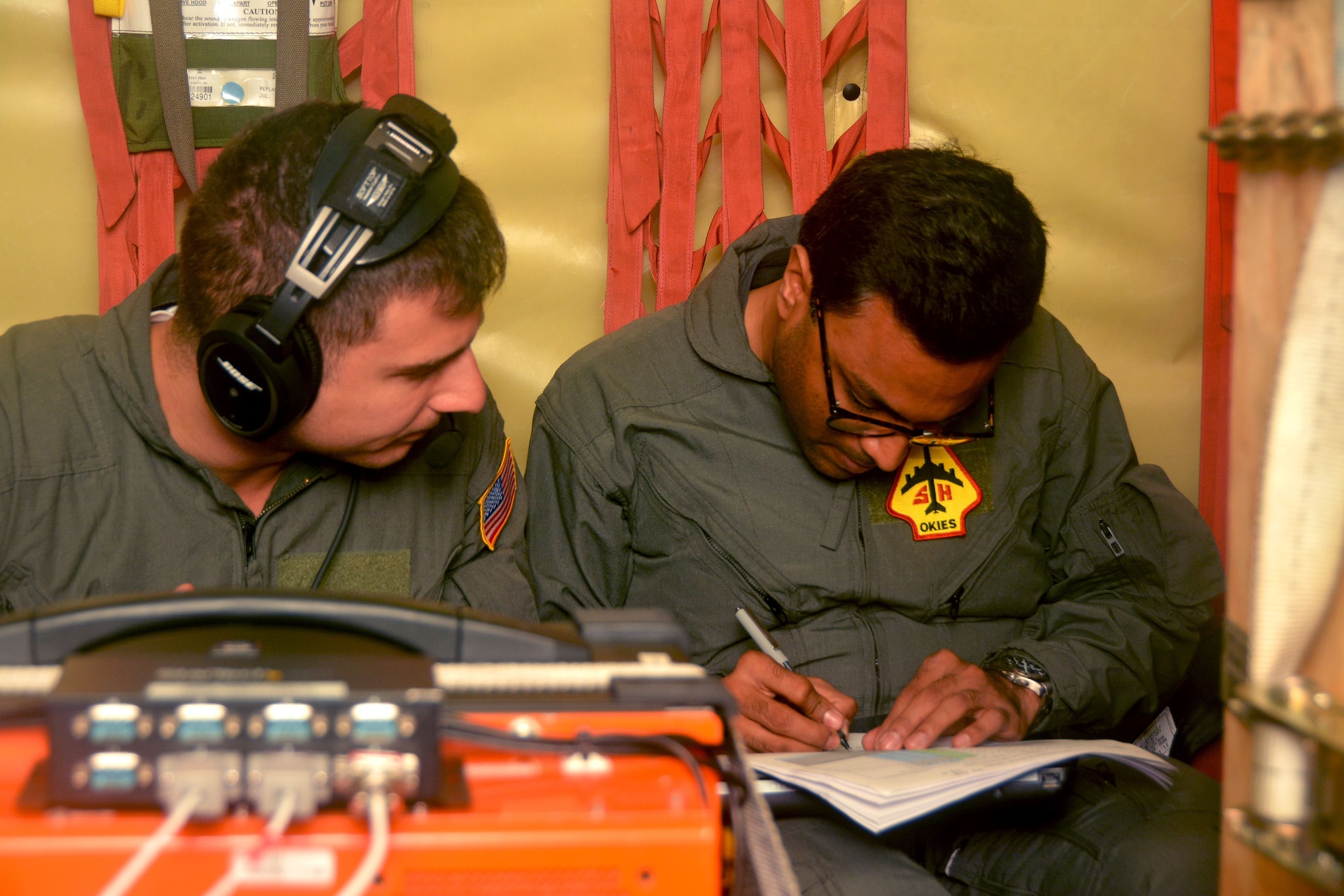 James Broches (left) and Swapnil Christian (right), Northrop Grumman flight test engineers at Eglin Air Force Base, Fla., monitor Large Aircraft Infrared Countermeasures system test equipment while in flight on a 507th Air Refueling Wing KC-135R Stratotanker from Tinker AFB, Okla., Nov. 29, 2017. Reserve Citizen Airmen flew the aircraft more than 60 times over a test range at Eglin AFB while a laser simulated incoming missiles for the LAIRCM system to detect and deflect. (U.S. Air Force photo/Tech. Sgt. Samantha Mathison)