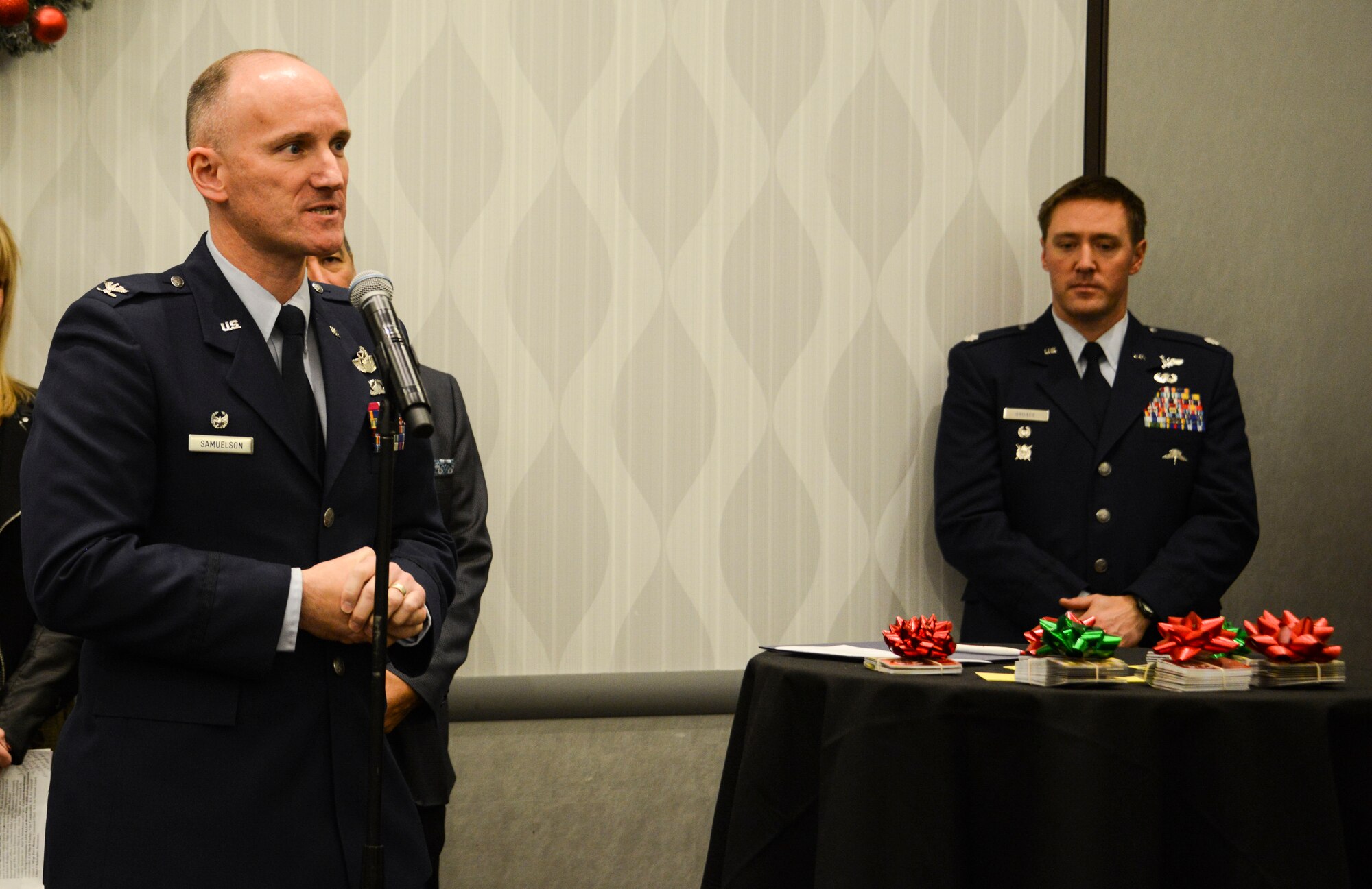 Col. Ryan Samuelson, 92nd Air Refueling Wing commander, speaks at the Operation Spokane Heroes presentation Dec. 12, 2017, at Northern Quest Resort and Casino, Spokane, Washington. Operation Spokane Heroes in partnership with the Kalispel Tribe of Indians presented Fairchild and other U.S. military units from the local community with gift cards for service members to enjoy this holiday season. (U.S. Air Force photo/Senior Airman Janelle Patiño)