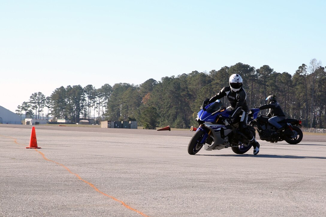 Motorcyclists practice one of the advanced techniques they learned during a level III motorcylce riders course aboard Marine Corps Air Station Cherry Point, N.C., Dec. 11, 2017. The level III curriculum was geared for advanced motorcycle riders and covered advanced motorcycle handling including how to safely and properly use brakes, perform U-turns and techniques for scanning the road to anticipate threats to a safe ride. This was the first level III training conducted this year. (U.S. Marine Corps photo by Pfc. Andrew King/ Released)