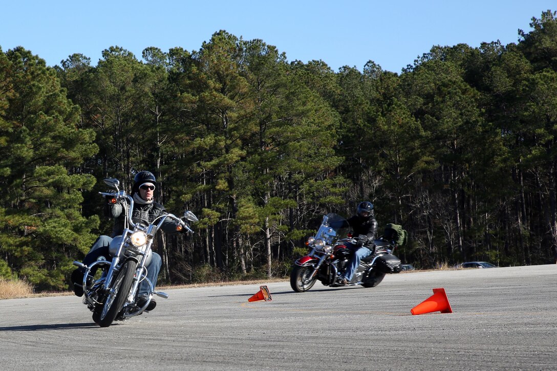 Motorcyclists complete familiarization laps around a training during a level III motorcylce riders course aboard Marine Corps Air Station Cherry Point, N.C., Dec. 11, 2017. The course was part of the level III motorcycle rider training. (U.S. Marine Corps photo by Pfc. Andrew King/ Released)