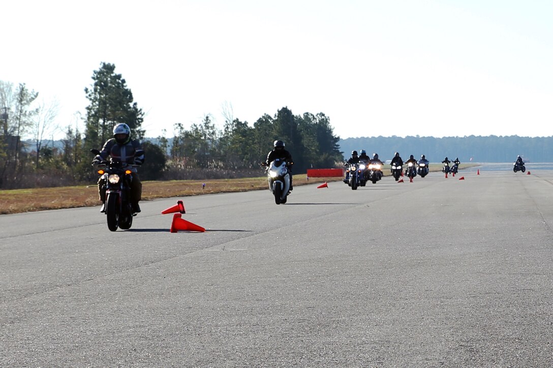 Students take familiarization laps around a training course during a level III motorcylce riders course aboard Marine Corps Air Station Cherry Point, N.C., Dec. 11, 2017. The level III curriculum was geared for advanced motorcycle riders and covered advanced motorcycle handling including how to safely and properly use brakes, perform U-turns and techniques for scanning the road to anticipate threats to a safe ride. (U.S. Marine Corps photo by Pfc. Andrew King/ Released)