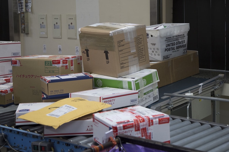CAMP FOSTER, OKINAWA, Japan – Outgoing mail waits on the conveyer belt to be processed and put into proper shipping areas Dec. 12 at the Camp Foster Post Office aboard Camp Foster, Okinawa, Japan.