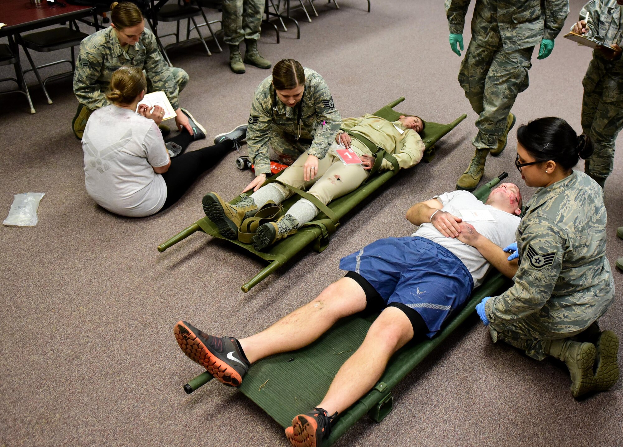 Members of the 4th Medical Group clinical team treat patients with simulated injuries during a mass casualty exercise Dec. 13, 2017, at Seymour Johnson Air Force Base, North Carolina.
