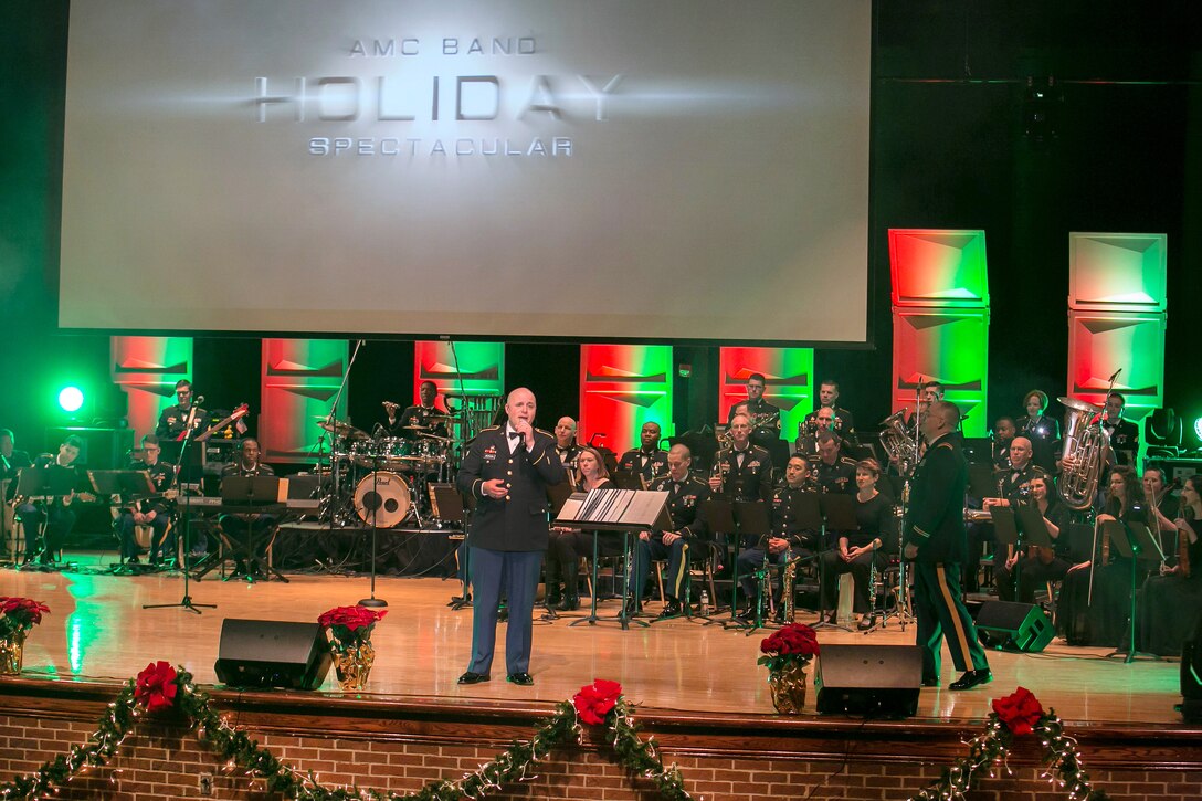 Army Spc. David Jackson performs a song during a holiday concert