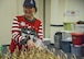 Jean Morris, spouse of Maj. Gen. Shaun Q. Morris, Air Force Nuclear Weapon Center commander, bags cookies during the Kirtland Spouse’s cookie drive at Kirtland Air Force Base, N.M., Dec. 12. The cookie drive’s purpose is to raise morale for Airmen, as many of them are spending the holidays away from their families.