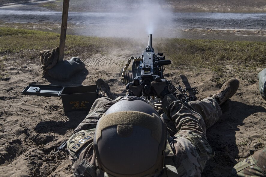 Staff Sgt. Richard Murkin, 823d Base Defense Squadron fireteam member, fires a .50 Caliber M2 machine gun, during a heavy weapons qualification, Dec. 13, 2017, at Camp Blanding Joint Training Center, Fla. Airmen shot at targets with the M2 to maintain their proficiency and familiarize themselves with the weapon. (U.S. Air Force photo by Senior Airman Janiqua P. Robinson)