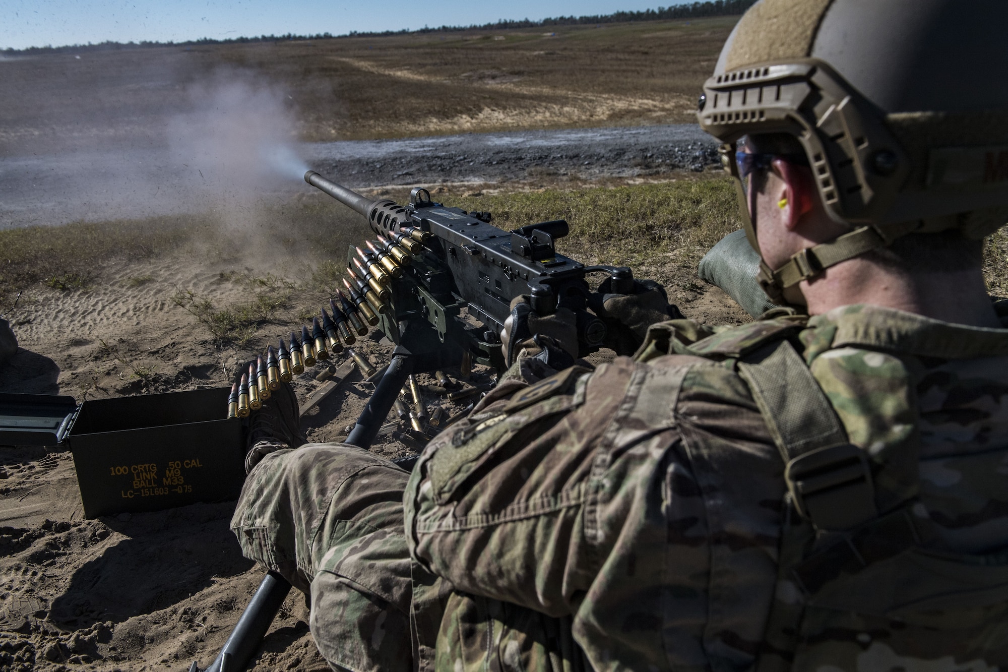 Staff Sgt. Richard Murkin, 823d Base Defense Squadron fireteam member, fires a .50 Caliber M2 machine gun during a heavy weapons qualification, Dec. 13, 2017, at Camp Blanding Joint Training Center, Fla. Airmen shot at targets with the M2 to maintain their proficiency and familiarize themselves with the weapon. (U.S. Air Force photo by Senior Airman Janiqua P. Robinson)