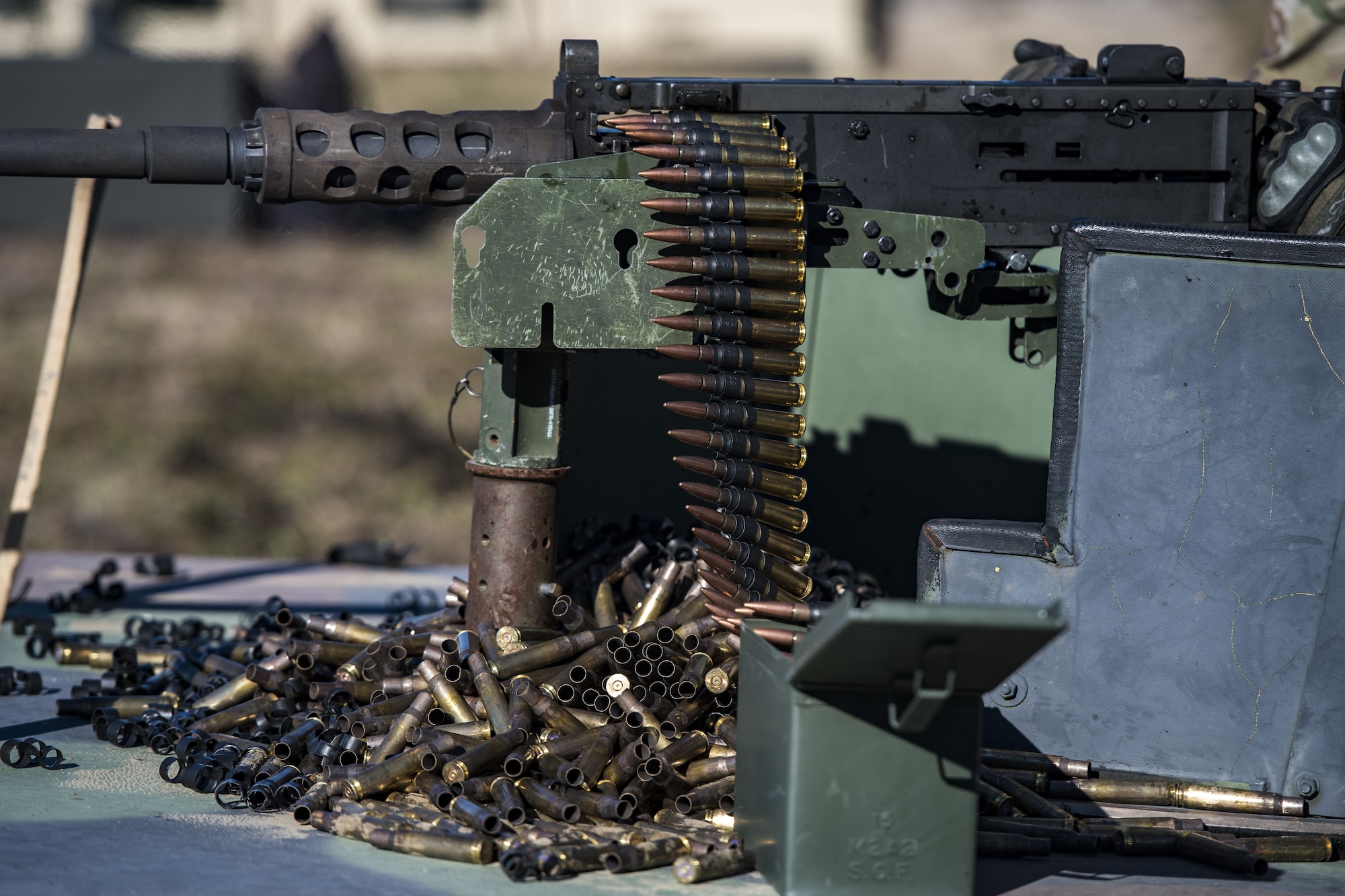 An Airman from the 823d Base Defense Squadron, readies a .50 Caliber M2 machine gun during a heavy weapons qualification, Dec. 13, 2017, at Camp Blanding Joint Training Center, Fla. Airmen shot at targets with the M2 to maintain their proficiency and familiarize themselves with the weapon. (U.S. Air Force photo by Senior Airman Janiqua P. Robinson)