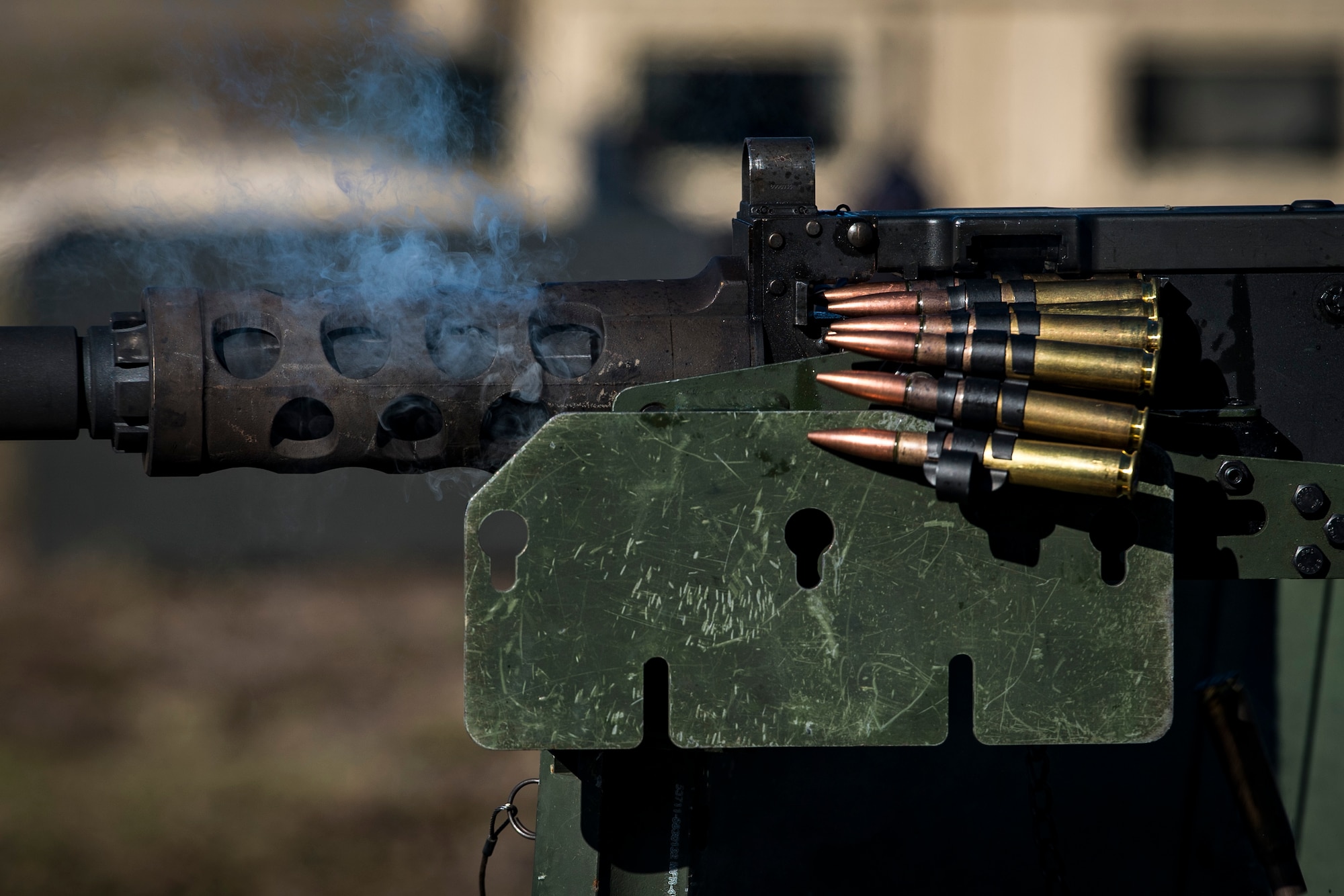 An Airman from the 823d Base Defense Squadron, fires a .50 Caliber M2 machine gun during a heavy weapons qualification, Dec. 13, 2017, at Camp Blanding Joint Training Center, Fla. Airmen shot at targets with the M2 to maintain their proficiency and familiarize themselves with the weapon. (U.S. Air Force photo by Senior Airman Janiqua P. Robinson)