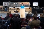 The U.S. ambassador to the United Nations stands in front of evidence during a news conference.