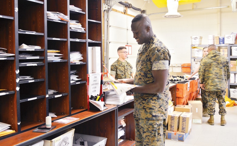 Cpl. Derrick Asiamah sorts mail at the Marine Corps Base Quantico Post Office.