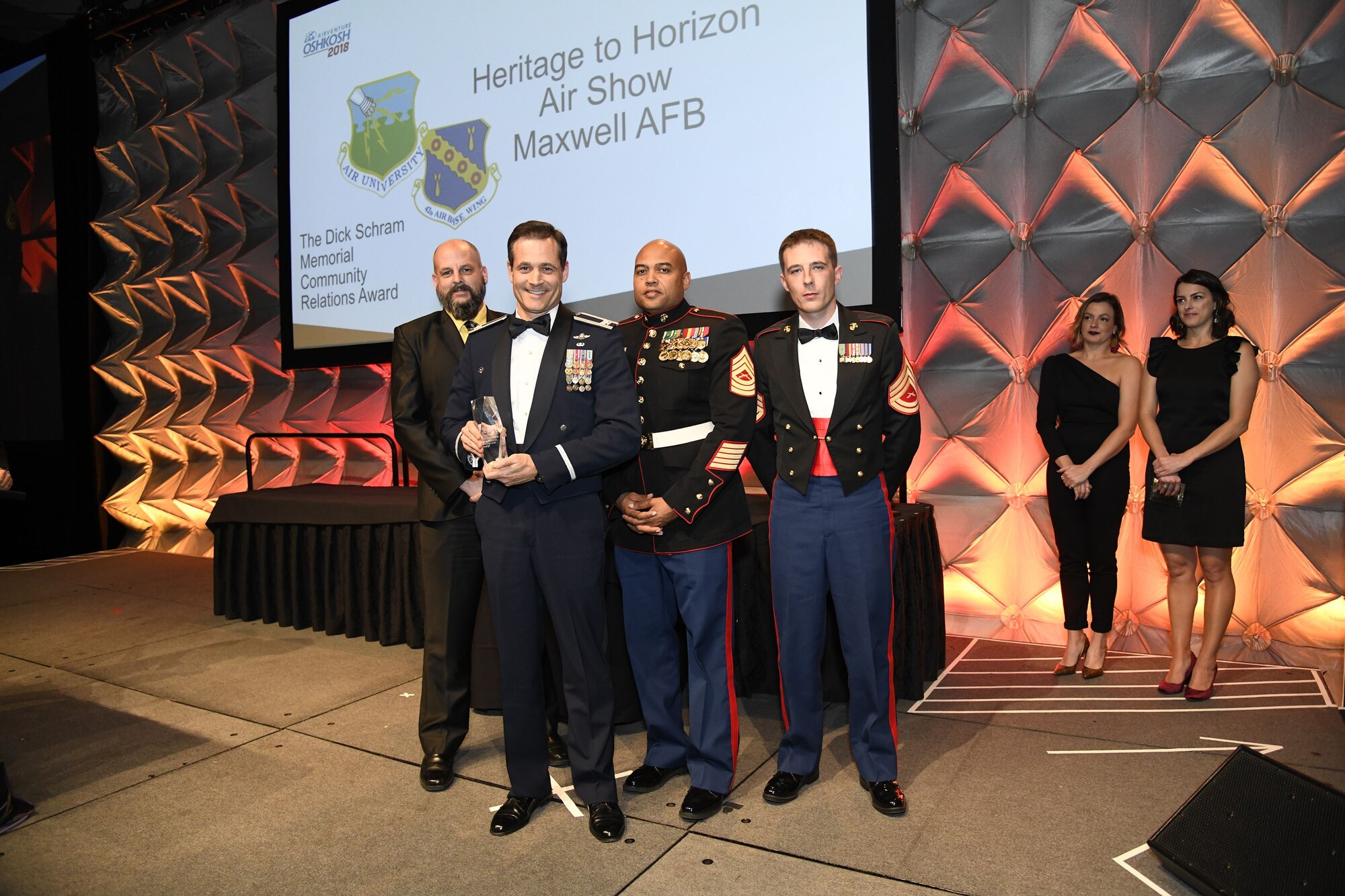 Col. Doug DeMaio (center), Curtis E. LeMay Center for Doctrine Development and Education vice commander and 2017 Maxwell Air Force Base Air Show director, receives the Dick Schram Memorial Community Relations Award Dec. 6, 2017, at the International Council of Air Shows Chairman's Banquet in Las Vegas, Nev. The award was presented for having the best air show in 2017. (Courtesy photo by Larry Grace)
