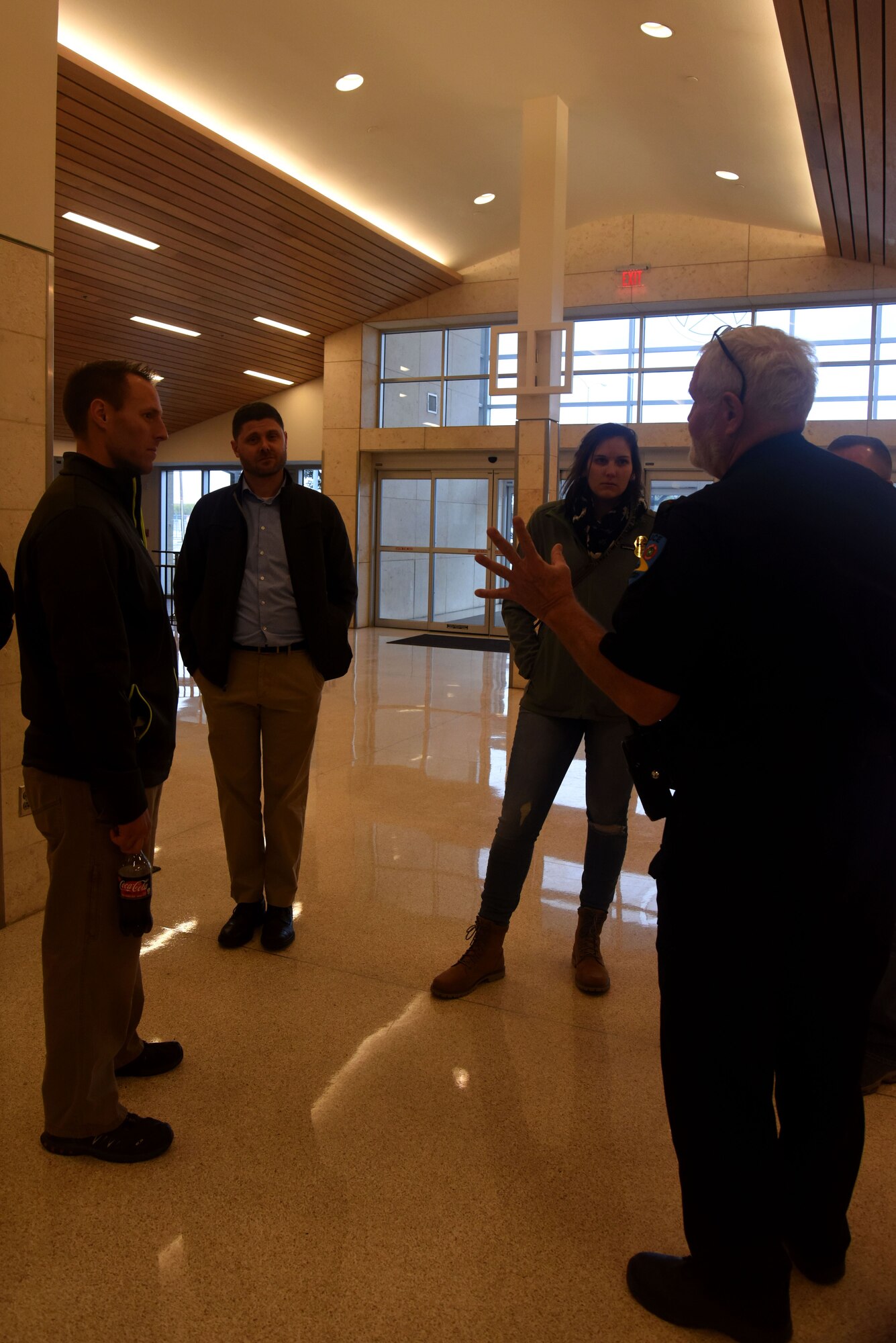 Mathis Airfield Police Officer Bruce Burkett explains different types of threats pertaining to commercial airports to students participating in the Aviation Domain Awareness Training Course at Mathis Airfield, San Angelo, Texas, Dec. 7, 2017. The students received a tour of Mathis Airfield to see what drives different procedures in a commercial airport. (U.S. Air Force photo by Airman 1st Class Seraiah Hines/Released)