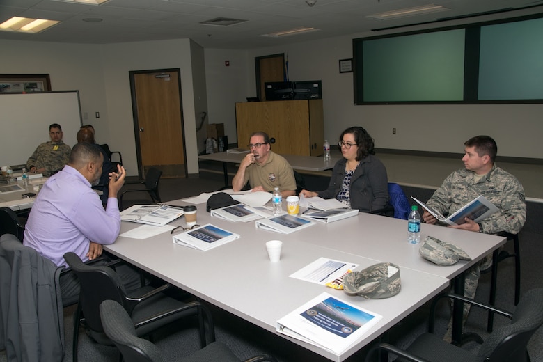 Students from multiple agencies attending the Aviation Domain Awareness Training Course conduct a table-top discussion on the last day of their training during an aviation security exercise at Goodfellow Air Force Base, Texas, Dec. 8, 2017. This last exercise put all of the knowledge the students had learned to the test throughout the length of the course. (U.S. Air Force photo by David Lynch/Released)