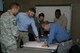 Students from the multiple agencies involved in the Aviation Domain Awareness Training Course brainstorm during an exercise at Goodfellow Air Force Base, Texas, Dec. 8, 2017. The week long course taught individuals from multiple agencies about the various threats and security systems in place to prevent any type of aviation threat that may arise in the future. (U.S. Air Force photo by David Lynch /Released)