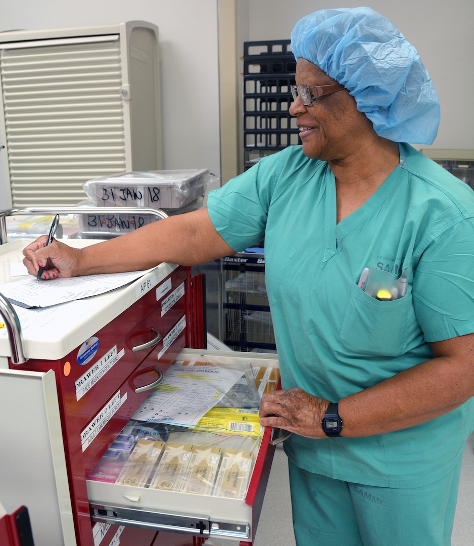 Lillie Williams, BAMC’s Sterile Processing and Distribution division crash cart maintainer, ensures a crash cart has the proper surgical instrumentation.