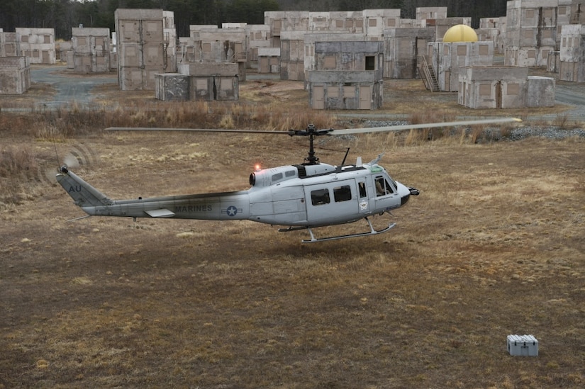 A UH-1 Huey helicopter equipped with an Office of Naval Research-sponsored Autonomous Aerial Cargo/Utility System autonomy kit makes an approach for landing during final testing at Marine Corps Base Quantico, Va.