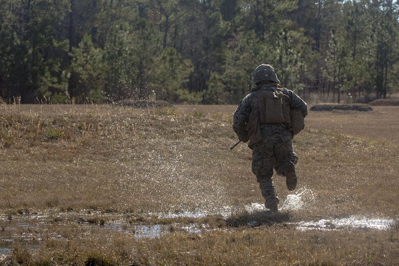 Charging forward: 1/2 assaults the objective, completes live-fire range