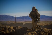 U.S. Marine Corps Lance Cpl. Damon Kindt, a rifleman with 2nd Battalion, 5th Marine Regiment, 1st Marine Division, hikes over a hill during an air assault, part of exercise Steel Knight 2018 at Marine Corps Air Ground Combat Center, Twentynine Palms, Calif., Dec. 8, 2017.