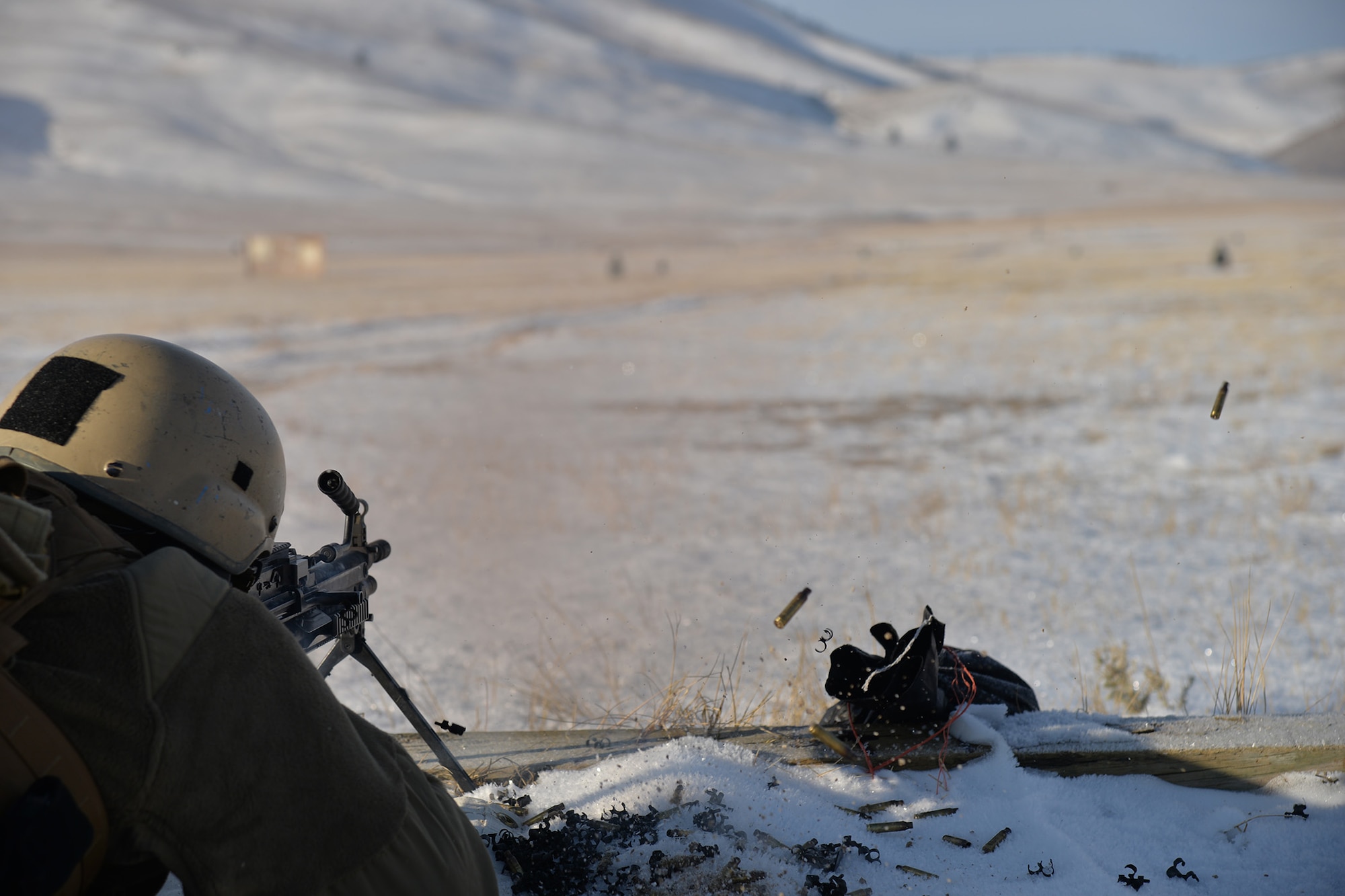 Senior Airman Kiev Nelson, 341st Security Support Squadron tactical response force nuclear advanced designated marksman, fires a M249 light machine gun Dec. 12, 2017, at Fort Harrison, Mont.