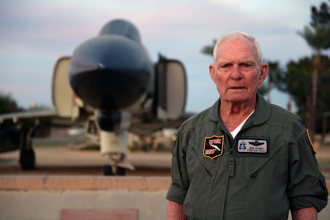 Retired Air Force pilot Lt. Col. Bob Pardo poses in front of a static display model of an F-4 Phantom II, one of the many fighter aircraft he has flown, at Luke Air Force Base, Ariz., Dec. 12, 2017. During the Vietnam War, Pardo saved the lives of a fellow Phantom aircrew when he used his own aircraft to push their battle-damaged jet almost 90 miles into friendly airspace. This act came to be known as “Pardo's Push.” (U.S. Air Force photo/Senior Airman Ridge Shan)