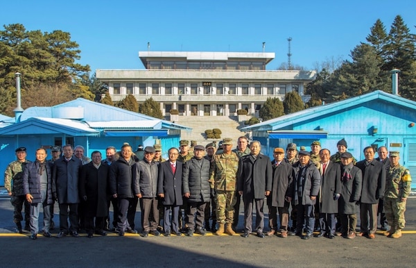 On December 12, Gen. Vincent K. Brooks, United Nations Command, Combined Forces Command and U.S. Forces Korea, commander and his staff pose for a picture with 13 former Senior Members of the United Nations Command Military Armistice Commission in the Joint Security Area, Panmunjeom.
