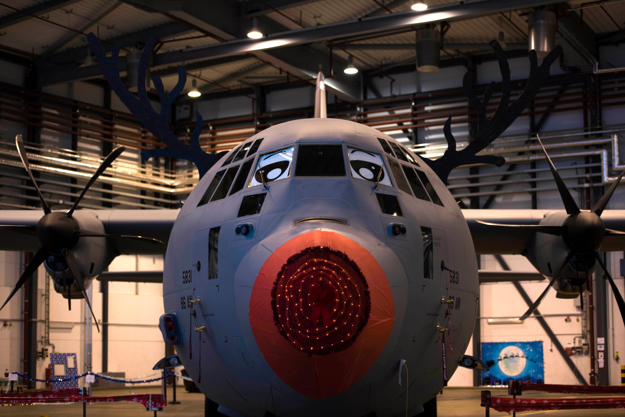 A U.S. Air Force C-130J Super Hercules, assigned to the 86th Airlift Wing, is decorated as Rudolph the Red Nosed Herc for an event, on Ramstein Air Base, Germany, Dec. 14, 2017. The 86th Maintenance Group hosted the event for families a part of the 86th AW. (U.S. Air Force photo by Senior Airman Devin M. Rumbaugh)