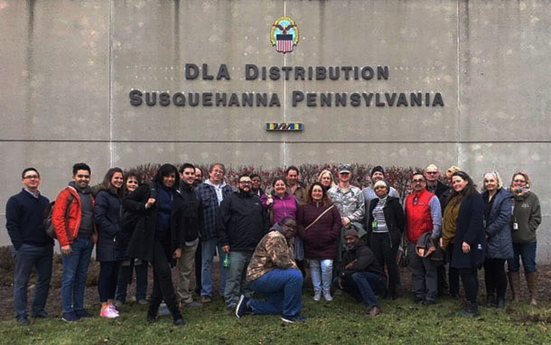 DLA Troop Support Industrial Hardware employees gather for a group photo during their visit to DLA Distribution’s Eastern Distribution Facility in New Cumberland, Pennsylvania, Dec. 13, 2017.