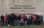 DLA Troop Support Industrial Hardware employees gather for a group photo during their visit to DLA Distribution’s Eastern Distribution Facility in New Cumberland, Pennsylvania, Dec. 13, 2017.