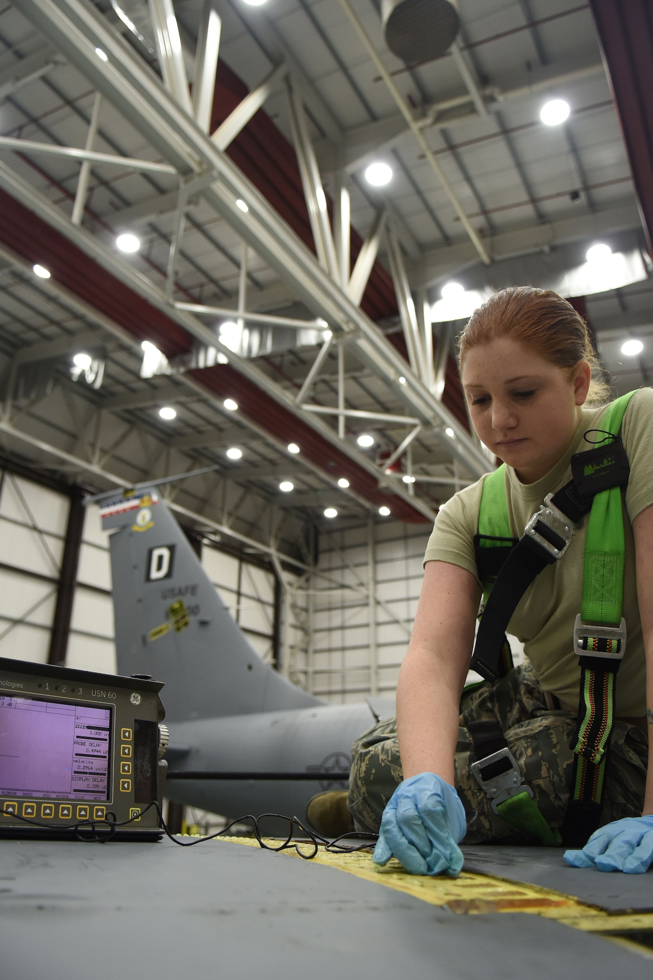 U.S. Air Force Airman 1st Class Kayla Laprade, 100th Maintenance Squadron Non-Destructive Inspection journeyman, conducts an ultra-sonic inspection on the right wing of a KC-135 Stratotanker on RAF Mildenhall, England, Dec. 12, 2017. The ultrasonic inspection checks for a difference in thickness of layers, which would indicate a weakness. (U.S. Air Force photo by Airman 1st Class Luke Milano)