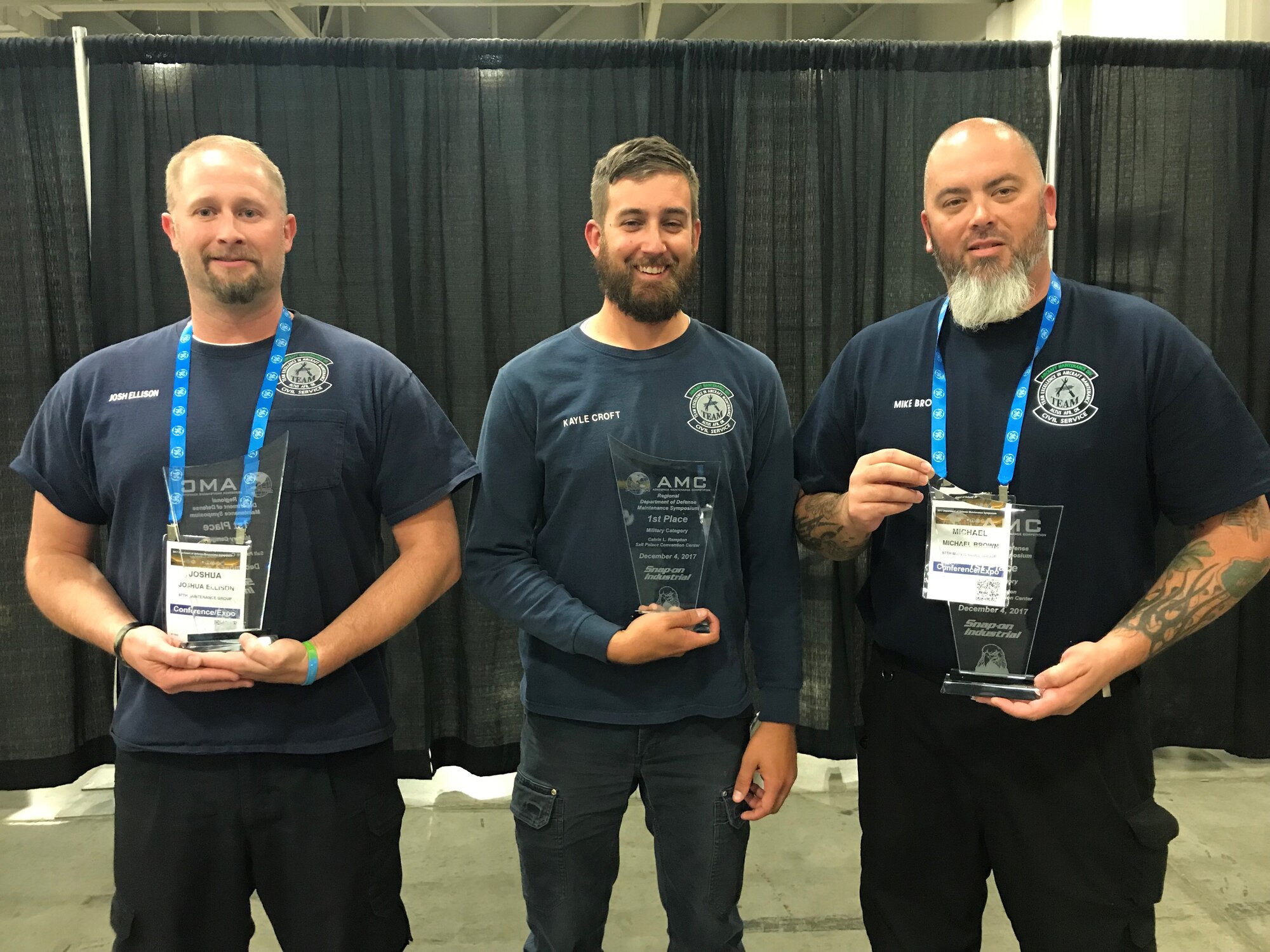 Josh Ellison, Kayle Croft and Mike Brown, aircraft mechanics assigned to the 97th Aircraft Maintenance Squadron, pose for a photo after winning the 2017 Aerospace Maintenance Competition, Dec. 4, 2017 in Salt Lake City, Utah.