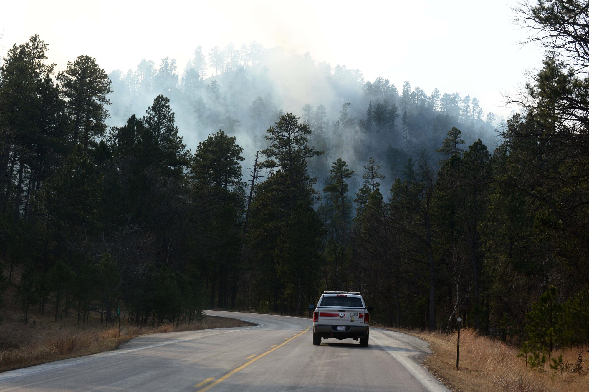 The park wildfire grew rapidly overnight, pushing beyond the park's borders and threatening nearby communities.