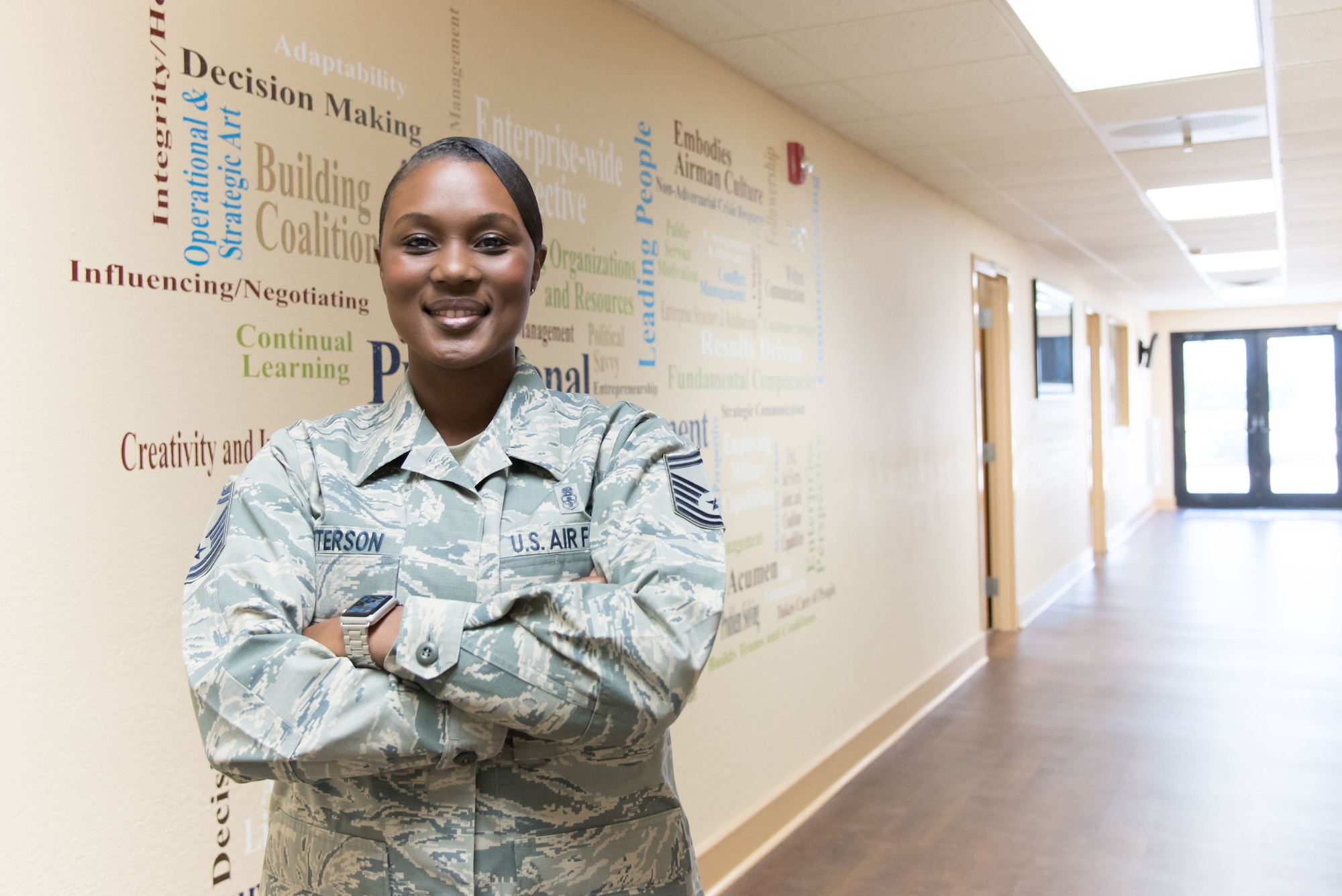 Senior Master Sgt. Tiffanny Patterson, Keesler career assistance advisor, poses for a photo at Keesler Air Force Base, Mississippi's recently rennovated Professional Development Center. Patterson is charged with facilitating professional development opportunities for reserve, active duty and civilian members of the base. (U.S. Air Force photo by Staff Sgt. Heather Heiney)
