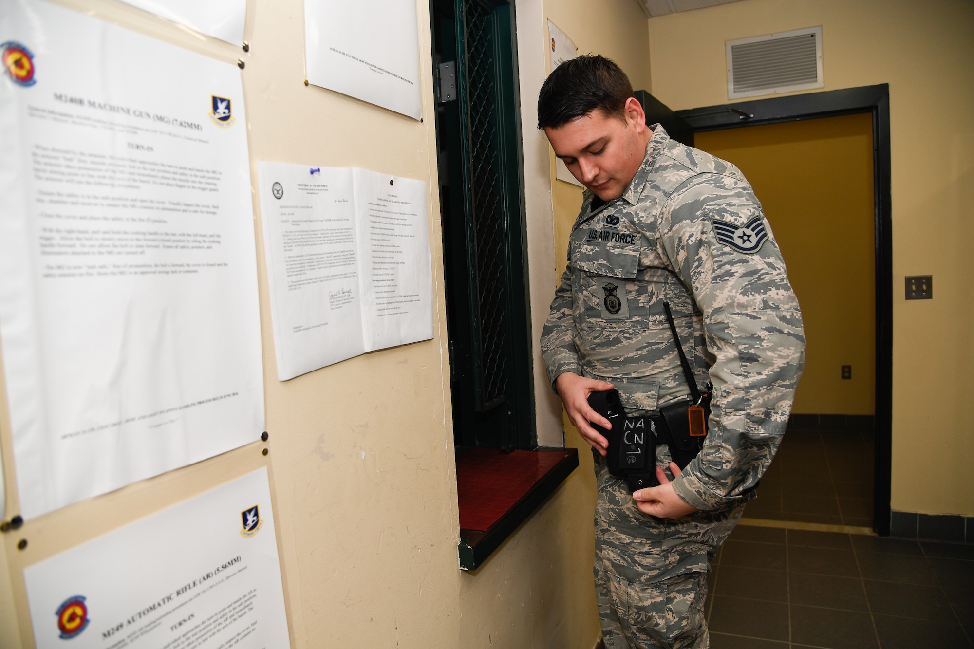 Staff Sgt. Matthew Pick, 66th Security Forces Squadron, equips himself with one of five opioid overdose medications.