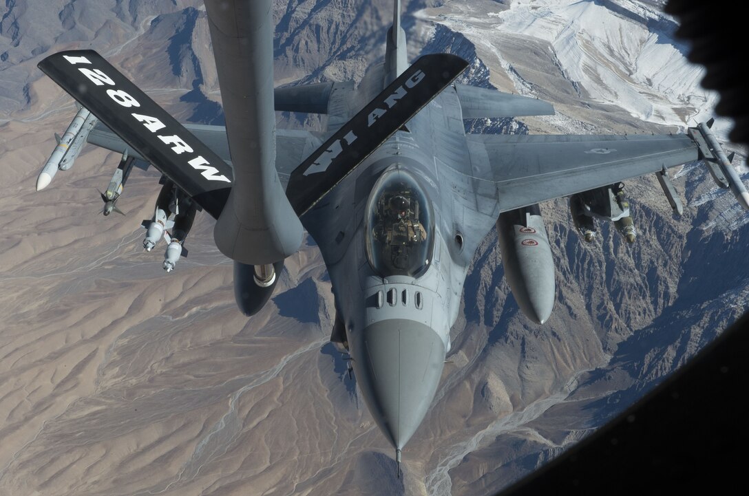 An F-16 Fighting Falcon, assigned to the 77th Expeditionary Fighter Squadron, prepares to be refueled by a KC-135 Stratotanker, over the skies of Afghanistan Nov. 19, 2017. F-16s are used to provide vital air support to Afghan and coalition forces on the ground. (U.S. Air Force photo by Staff Sgt. Sean Martin)